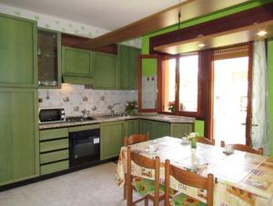 A kitchen or kitchenette at Furnished apartment near the beach
