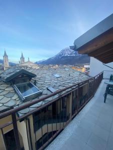 a balcony of a building with a view of a mountain at Apartments Il Delfino in Aosta