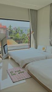 Ein Bett oder Betten in einem Zimmer der Unterkunft Jeju Homestay