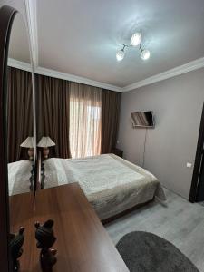 Postel nebo postele na pokoji v ubytování Апартаменты в Кобулети