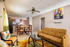 Seating area sa Fully AC 2BR, 5 mins from Ian Fleming Int Airport