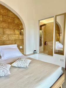 Postel nebo postele na pokoji v ubytování Terrazza Levante - Boutique rooms