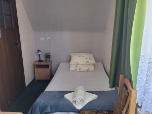 Posteľ alebo postele v izbe v ubytovaní Pokoje Gościnne "Tęcza"