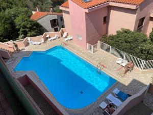 a large swimming pool in front of a house at Collioure, entre mer, piscine & montagne in Collioure
