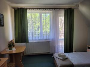 Posteľ alebo postele v izbe v ubytovaní Pokoje Gościnne "Tęcza"