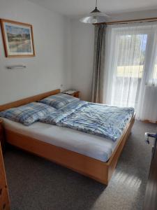 מיטה או מיטות בחדר ב-Chalet Schwaiberg