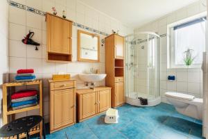 a bathroom with a sink toilet and a shower at Altes Forsthaus Königskrug in Braunlage +42 photos