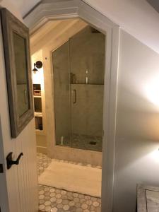 a bathroom with a shower with a glass door at Beautiful Luxury Suite A of Shorewood Home in Shorewood +26 photos
