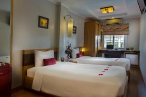 Voodi või voodid majutusasutuse Eliana Ruby Hotel & Travel toas