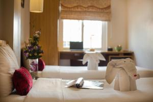 Voodi või voodid majutusasutuse Eliana Ruby Hotel & Travel toas