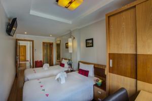 Voodi või voodid majutusasutuse Eliana Ruby Hotel & Travel toas