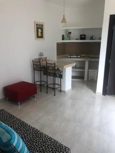 a kitchen with a table and chairs in a room at Casa Bella Suit in Salinas +7 photos