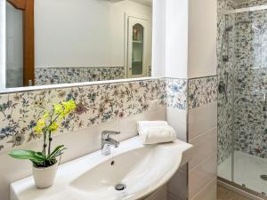 a bathroom with a sink and a shower at Magdalene's House - sea view terrace in Massa Lubrense +17 photos