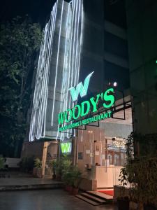a building with a sign that reads my woodys restaurant at Woody's in Bangalore