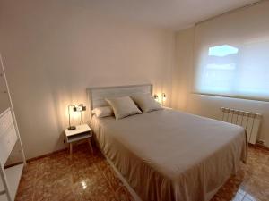 A bed or beds in a room at Atico duplex en Malgrat de Mar
