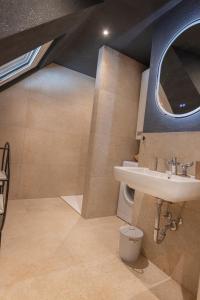 a bathroom with a sink and a mirror at Deluxe Apartement Tirol in Landeck
