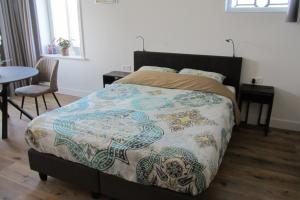 En eller flere senge i et værelse på Aan de Dijk