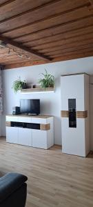 a living room with a tv and a couch at Wachau Supperer in Rossatz