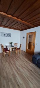 a living room with a table and chairs and a couch at Wachau Supperer in Rossatz +11 photos