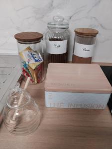 a wooden table with a box and containers of food at PRIMO - Logement 4/6 personnes in Braux