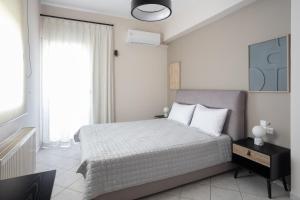 Ένα ή περισσότερα κρεβάτια σε δωμάτιο στο Olive Apartment Crete +83 φωτογραφίες