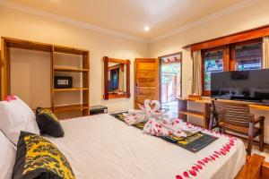 Postel nebo postele na pokoji v ubytování Paradise Villa Gili Air