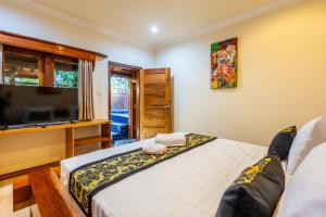 Postel nebo postele na pokoji v ubytování Paradise Villa Gili Air