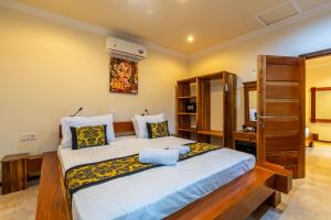 Postel nebo postele na pokoji v ubytování Paradise Villa Gili Air