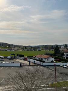 an aerial view of a parking lot with a building at Studio à Saint-Palais avec parking. in Saint-Palais