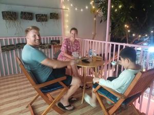 a group of people sitting around a table at AUTHENTIC HOMESTAY in Can Tho