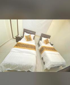 Krevet ili kreveti u jedinici u okviru objekta شقق غصن الجزيرة المخدومة