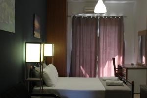 Posteľ alebo postele v izbe v ubytovaní Village Drapanias Apartments