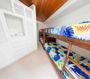 a bedroom with two bunk beds in a room at casa javi in Santa Marta