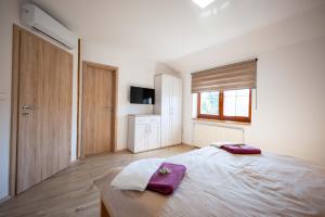 Postel nebo postele na pokoji v ubytování PAPI Apartmán
