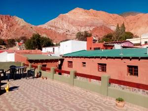 a view of a town with mountains in the background at Ipay Alojamiento Familiar in Purmamarca