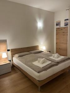 a bedroom with a large bed with two pillows on it at Interno 12 Sweet Home in Verona