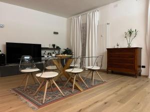 a dining room with a glass table and chairs at Interno 12 Sweet Home in Verona