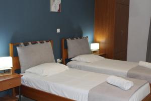Posteľ alebo postele v izbe v ubytovaní Village Drapanias Apartments