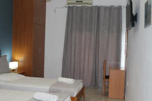 Posteľ alebo postele v izbe v ubytovaní Village Drapanias Apartments