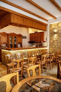 A restaurant or other place to eat at Artemis Hotel