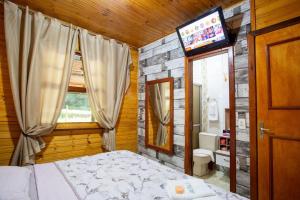 Giường trong phòng chung tại Piscina aquecida 32g, casa 3 quartos, + hidro