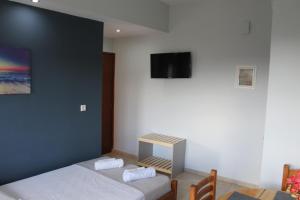 Posteľ alebo postele v izbe v ubytovaní Village Drapanias Apartments