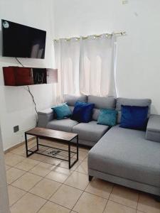 a living room with a couch and a coffee table at casa familiar san miguel in San Miguel