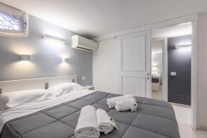 Tempat tidur dalam kamar di Orso Apartment