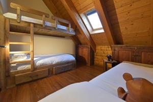 a bedroom with two bunk beds in a cabin at L'Ame du Mont blanc vda.cir 0061 in Pré-Saint-Didier