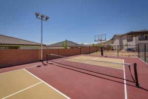 a tennis court with a net on a tennis court at Zion's Paradise townhouse in Hurricane