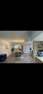 a large living room with a table and a kitchen at 2 bedroom Apt in long branch in Long Branch