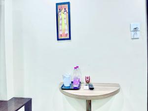 a table with cosmetics on it in a room at Hotel Yashasvi ! Puri fully-air-conditioned-hotel near-sea-beach-&-temple with-lift-and-parking-facility breakfast-included in Puri