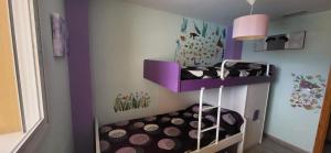 A bed or beds in a room at Xeraco Beach Alma