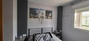 A bed or beds in a room at Xeraco Beach Alma